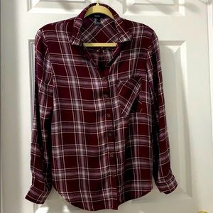 Burgundy button down shirt.